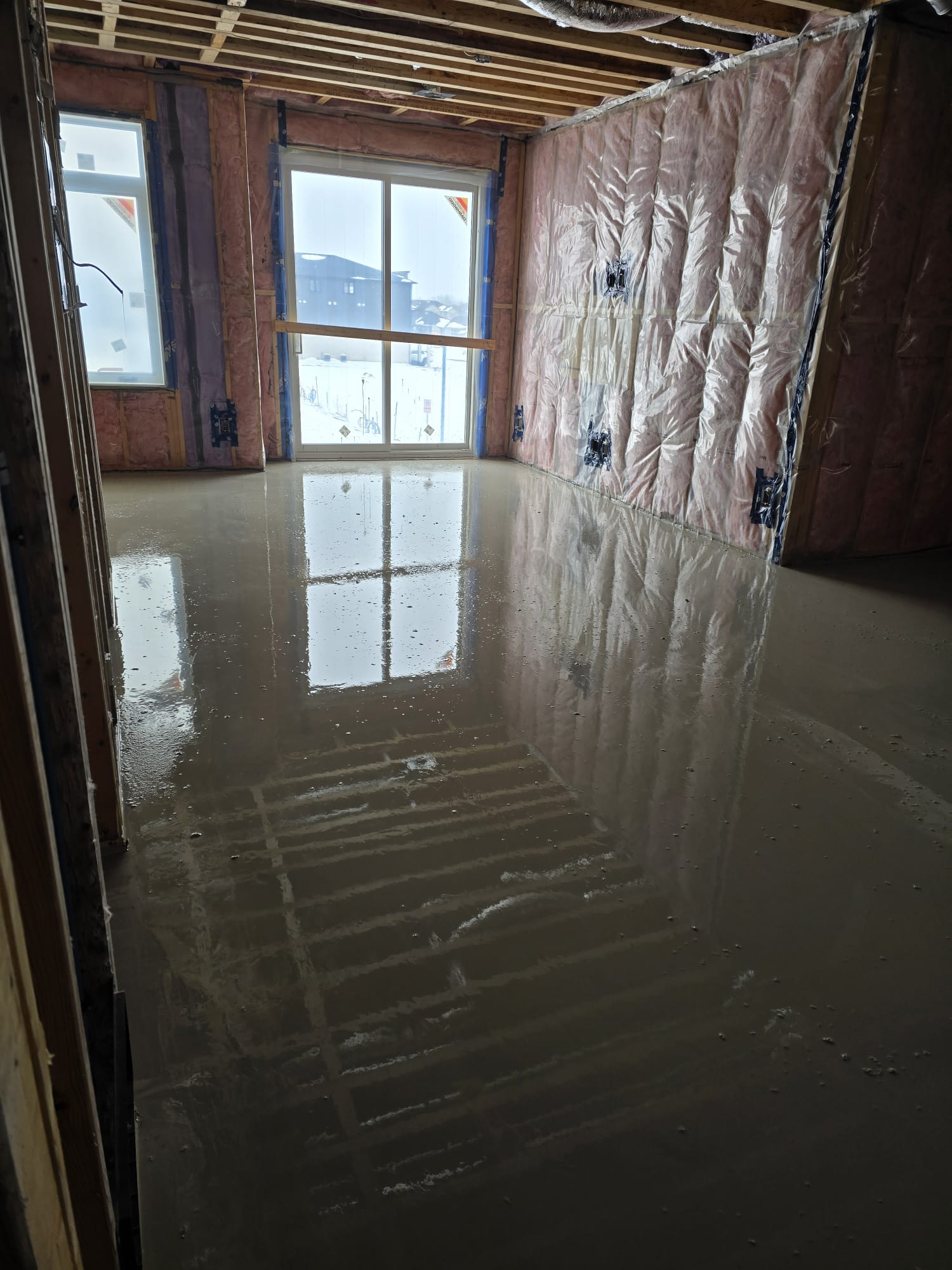 Freshly poured self-leveling floor, representing the Rideau Street project